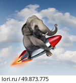 Courage and determination as a potential and possibilities concept with a realistic elephant flying in the air using a rocket as a business symbol of achievement and belief in your abilities to succeed in upward growth. Стоковое фото, агентство Ingram Publishing / Фотобанк Лори