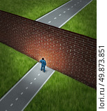 Business challenge and financial obstacles concept with a businessman standing in front of a large brick wall that has blocked his path and obstructed a journey to success. Стоковое фото, агентство Ingram Publishing / Фотобанк Лори