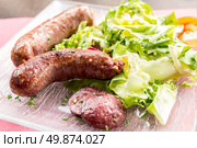 grilled german sausages serve with fresh vegetable. Стоковое фото, агентство Ingram Publishing / Фотобанк Лори