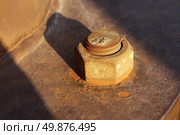 Dying industry and old industries as a business concept with an antique industrial rusted nut and bolt with the sun lighting setting on a market segment that is losing profitability and the needs modernisation. Стоковое фото, агентство Ingram Publishing / Фотобанк Лори