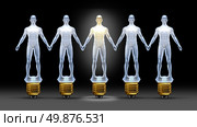 Community ideas with a group of light bulbs shaped as business people holding hands with a leader person illuminated shinning bright as a concept of creative team success through connections and networking. Стоковое фото, агентство Ingram Publishing / Фотобанк Лори