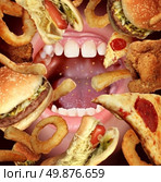 Eating problems and unhealthy diet struggling to follow healthy dieting as a health concept by the temptations of fried fast food as a hamburger hot dog french fries onion rings pizza with an opened hungry mouth. Стоковое фото, агентство Ingram Publishing / Фотобанк Лори