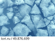 Broken ice background as a concept of blue frigid cold temperatures as in the arctic polar climate with chunks of below zero frozen water representing cool refrigerated environment. Стоковое фото, агентство Ingram Publishing / Фотобанк Лори