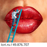 Plastic surgery and cosmetic improvement medical health care concept with a surgeon doctor climbing a ladder ti fix and restore human lips as an idea of fighting the aging process to retain beauty.s. Стоковое фото, агентство Ingram Publishing / Фотобанк Лори