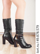 Beautiful patent leather boots with slender legs. Стоковое фото, агентство Ingram Publishing / Фотобанк Лори