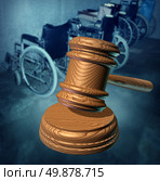 Disability Rights and fighting in a court of law for equal opportunity to citizens that are handicapped or phisically challenged to access services as a group of wheelchairs and a wooden judges gavel protecting the vulnerable. Стоковое фото, агентство Ingram Publishing / Фотобанк Лори