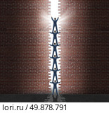 Group leadership breakout business concept with a team of business people cooperating together to open a hole in brick wall with a top manager directing the planned strategy as a symbol for success. Стоковое фото, агентство Ingram Publishing / Фотобанк Лори