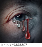 Increasing depression dangers as a mental health issue related to despair and emotional illness based on grief or chemical imbalance anxiety risk in a close up of a human eye crying a tear drop that gradualy transforms into blood. Стоковое фото, агентство Ingram Publishing / Фотобанк Лори