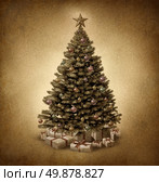Old fashioned Christmas tree on vintage parchment paper grunge texture with traditional ornate decorative balls and gifts with ribbons and bows as a clasic seasonal symbol of winter celebration and festive new year. Стоковое фото, агентство Ingram Publishing / Фотобанк Лори