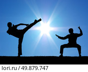 Two warrior silhouettes on the sun background. . Стоковое фото, агентство Ingram Publishing / Фотобанк Лори
