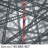 Determined focus business concept with a courageous businessman climbing up a red success ladder while avoiding the chaos of confusing and dangerous distractions as a metaphor of clear direction leadership. Стоковое фото, агентство Ingram Publishing / Фотобанк Лори