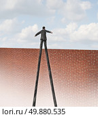 Rise to the challenge and adapt to adversity going over the wall business concept with a businessman with very long legs reaching the edge of a tall brick wall as a metaphore for freedom and success with a qualified leader. Стоковое фото, агентство Ingram Publishing / Фотобанк Лори