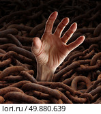 Break free from the chains as a business concept for freedom from constraints and heavy rules as a group of rusted metal chians with a human hand emerging out to be rescued or escaping the prison. Стоковое фото, агентство Ingram Publishing / Фотобанк Лори
