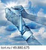 Health care justice concept with the clenched hands of an elderly hospital patient wearing arm wrist tags with the scales of equality for patients rights on a blue sky as a symbol of medical law  in regards to abuse and neglect. Стоковое фото, агентство Ingram Publishing / Фотобанк Лори
