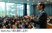 A man is standing in front of a large crowd of people, facing them. He appears to be speaking or addressing the audience. Стоковое AI-изображение, AI-художник Данила Большаков / Фотобанк Лори