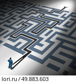 Solving Problems and problem solver business concept as the cast shadow of a businessman navigating through a complicated maze to freedom as a financial metaphor for predicting the future through leadership expertise and management skills. Стоковое фото, агентство Ingram Publishing / Фотобанк Лори