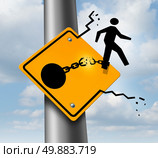 Escaping to freedom business concept as a businessman symbol on a traffic sign breaking free from the restrains of a ball and chain as a success metaphor of a new career or conquering adversity and emotional stress. Стоковое фото, агентство Ingram Publishing / Фотобанк Лори