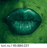 Witch symbol and wicked witchcraft black magic concept as a close up of a wrinkled green skinned sexy sorceress lips as a fantasy fiction or fairy tale  halloween character. Стоковое фото, агентство Ingram Publishing / Фотобанк Лори