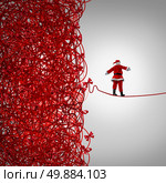 Santa Claus freedom and holiday management gift giving crisis as a concept with santaclause as a tightrope walker walking out of a confused tangled chaos of red ribbons breaking free to a clear as a metaphor for managing and escaping Christmas stress. Стоковое фото, агентство Ingram Publishing / Фотобанк Лори