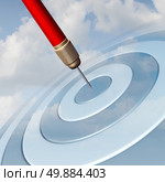Target Marketing business concept as a red dart hitting the center of a dartboard image in the sky as a success metaphor for winning and aspire to a focused strategy  to aim for success. Стоковое фото, агентство Ingram Publishing / Фотобанк Лори