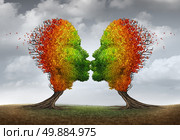 Aging couple relationship symbol and losing sex drive concept or low sexual desire metaphor as two trees shaped as kissing human heads losing leaves as in autumn season. Стоковое фото, агентство Ingram Publishing / Фотобанк Лори