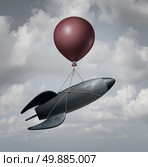 Old Technology business concept as an old rocket ship being lifted and transported by a single balloon as a solution metaphor for recovery with old tools after a technological failure. Стоковое фото, агентство Ingram Publishing / Фотобанк Лори