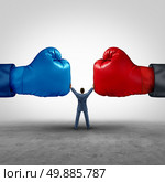Mediate and legal mediation business concept as a businessman or person separating two boxing glove opposing competitors as an arbitration success symbol for finding common interests to lawfully solve a conflict. Стоковое фото, агентство Ingram Publishing / Фотобанк Лори