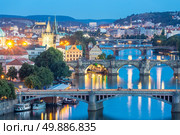 view of Bridges on Vltava, Prague at dusk, Czech Republic. Стоковое фото, агентство Ingram Publishing / Фотобанк Лори