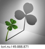 Low self esteem psychological concept as a four leaf clover casting a shadow with only three leaves as a mental health condition of feeling inadequate or negative thinking and low self confidence. Стоковое фото, агентство Ingram Publishing / Фотобанк Лори