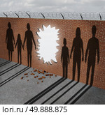 Open immigration and migration policy pertaining to a refugee crisis or illegal immigrants issues as a broken border wall with an entrance hole as a metaphor for gouvernment migration. Стоковое фото, агентство Ingram Publishing / Фотобанк Лори