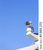 CCTV security camera over blue sky. Стоковое фото, агентство Ingram Publishing / Фотобанк Лори