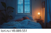 A bed positioned beneath a window in a room, illuminated by a lamp on a nightstand. Стоковое AI-изображение, AI-художник Данила Большаков / Фотобанк Лори