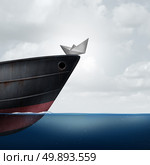 Big business helping small business as a financial  and corporate support metaphor as a huge ship providing assistance to a small paper boat as a symbol for investment or economic funding of smaller companies with 3D illustration elements. Стоковое фото, агентство Ingram Publishing / Фотобанк Лори