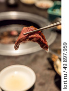 grilled Japanese wagyu kalbi rib meat BBQ yakiniku. Стоковое фото, агентство Ingram Publishing / Фотобанк Лори