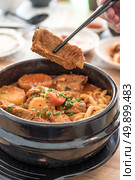 Gamjatang Korean Spicy Pork rib Soup with Kimchi and udon. Стоковое фото, агентство Ingram Publishing / Фотобанк Лори