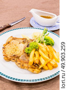 grilled pork chops with french fries. Стоковое фото, агентство Ingram Publishing / Фотобанк Лори