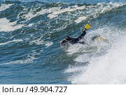 Bodyboarder in action on the ocean waves on a sunny day. Стоковое фото, агентство Ingram Publishing / Фотобанк Лори