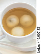 Sticky rice pearls stuff with blacksesame in ginger soup. Стоковое фото, агентство Ingram Publishing / Фотобанк Лори