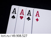 ace four of a kind poker card on dark black background. Стоковое фото, агентство Ingram Publishing / Фотобанк Лори