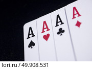 ace four of a kind poker card on dark black background. Стоковое фото, агентство Ingram Publishing / Фотобанк Лори