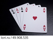 ace four of a kind poker card on dark black background. Стоковое фото, агентство Ingram Publishing / Фотобанк Лори