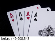 four of a kind poker card on dark black background. Стоковое фото, агентство Ingram Publishing / Фотобанк Лори