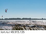 Kiteboarder enjoy surfing on a sunny day. Стоковое фото, агентство Ingram Publishing / Фотобанк Лори