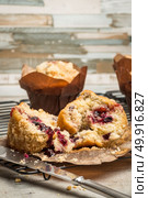 Muffins with red fruits jam fill on wooden counter top. Стоковое фото, агентство Ingram Publishing / Фотобанк Лори