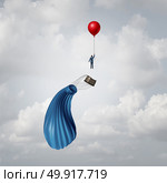 Leaving a failing business concept and plan B strategy as urgent contingency planning as a businessman escaping from a falling hot air balloon as a contingency symbol with 3D illustration elements. Стоковое фото, агентство Ingram Publishing / Фотобанк Лори