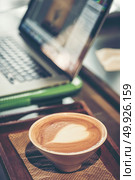 coffee latte art with business computer. Стоковое фото, агентство Ingram Publishing / Фотобанк Лори