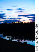 landscape sunset over the tropical lake in Thailand. Стоковое фото, агентство Ingram Publishing / Фотобанк Лори