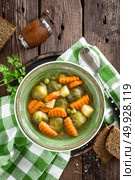 Vegetable soup with brussel sprouts on wooden rustic table, top view. Стоковое фото, агентство Ingram Publishing / Фотобанк Лори