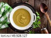 Vegetable cream soup, puree on wooden rustic table, top view. Стоковое фото, агентство Ingram Publishing / Фотобанк Лори
