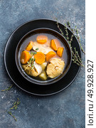Delicious fresh fish soup with hake in bowl on table. Top view. Стоковое фото, агентство Ingram Publishing / Фотобанк Лори